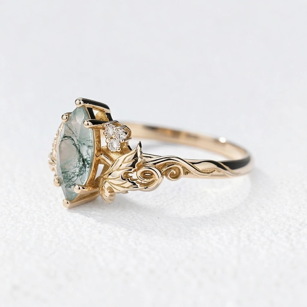Flora’s Laurel | Marquise Cut Moss Agate Engagement Ring with Diamond Leaves.