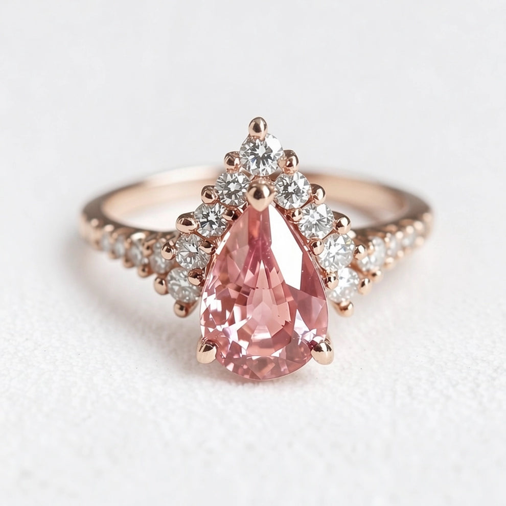 Aurora’s Promise |  Pear Cut Pink Sapphire Halo Engagement Ring.