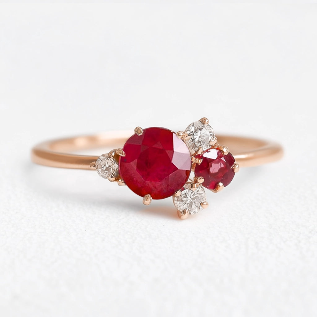 Rosalind’s Rose | Round Ruby Engagement Ring with Drifting Diamond Petal Halo.