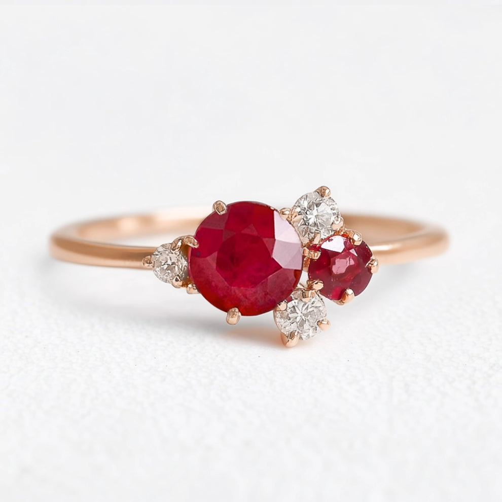 Rosalind’s Rose | Round Ruby Engagement Ring with Drifting Diamond Petal Halo.