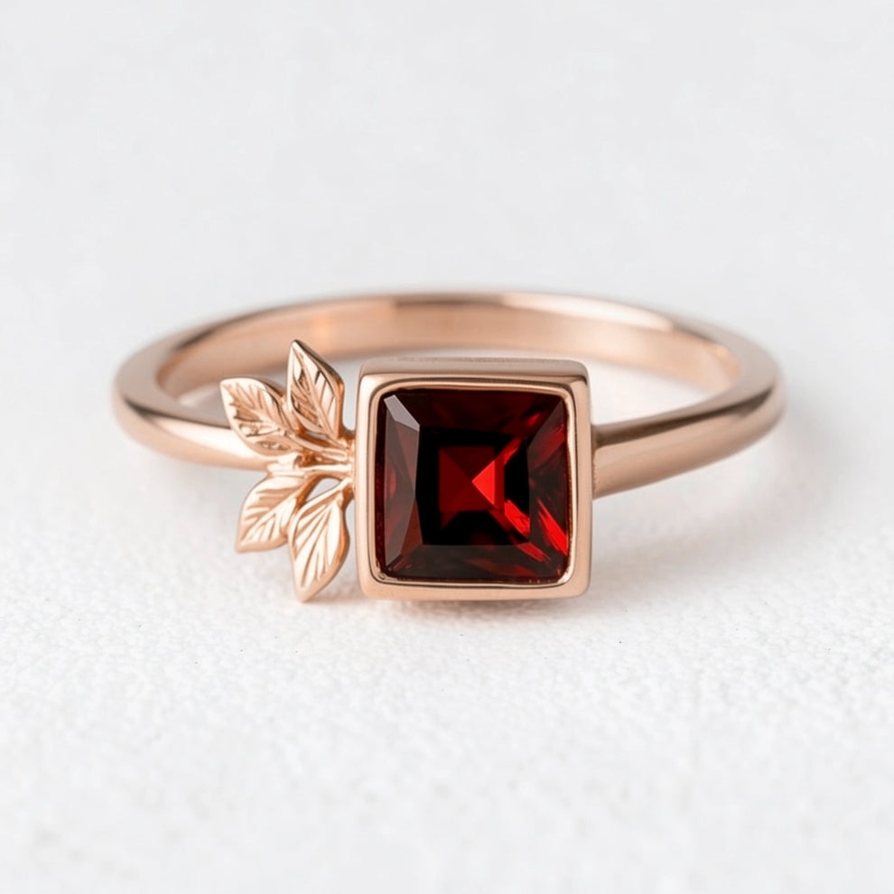 Rosalind’s Solace | Square Garnet Engagement Ring with Asymmetric Leaf.