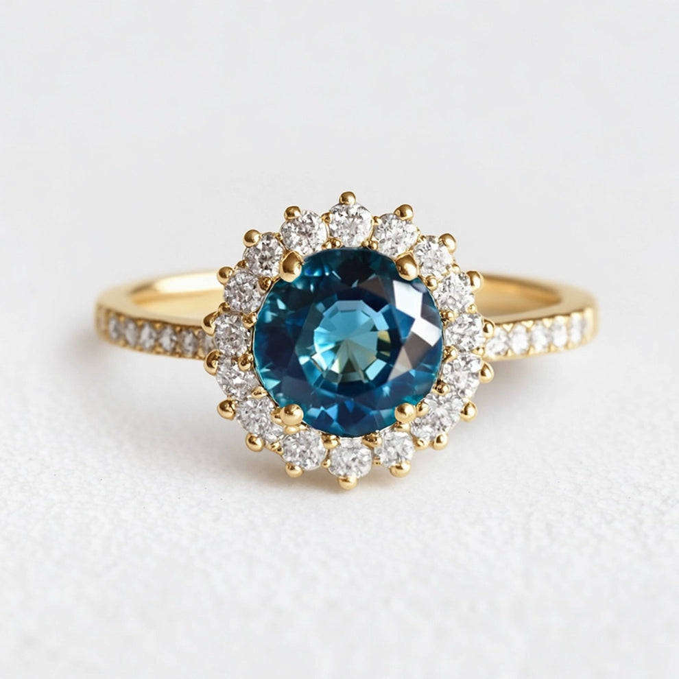 Stella's Spark | Vintage Blue Sapphire Diamond Halo Engagement Ring.