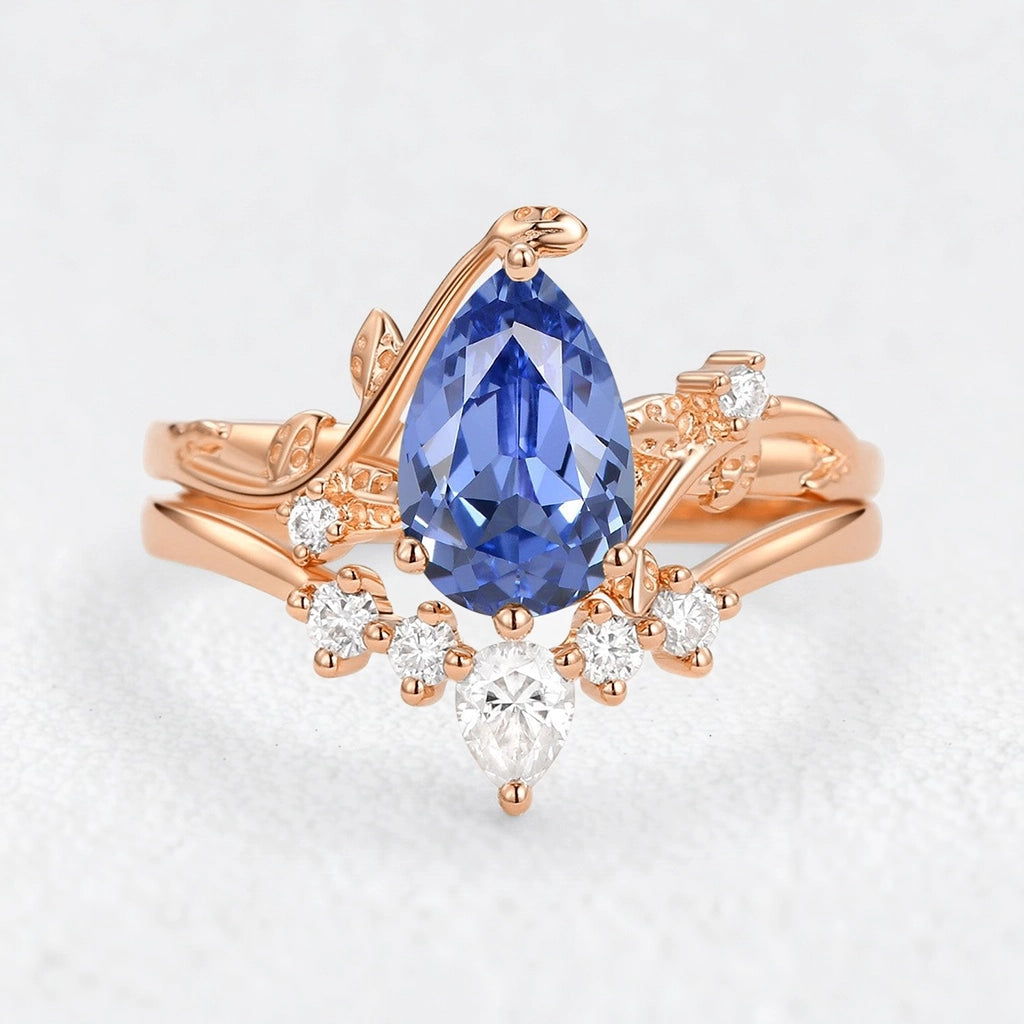 Eleonora’s Mirage | 1.5CT Pear Cut Tanzanite Foliage Bridal Duo