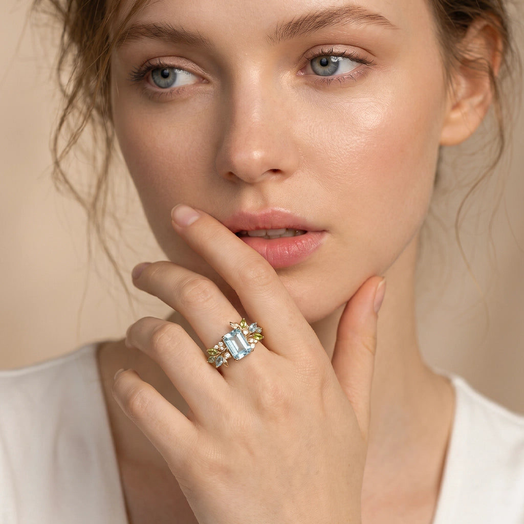 Calista’s Bloom | Emerald Cut Aquamarine Engagement Ring with Asymmetric Floral Accents.