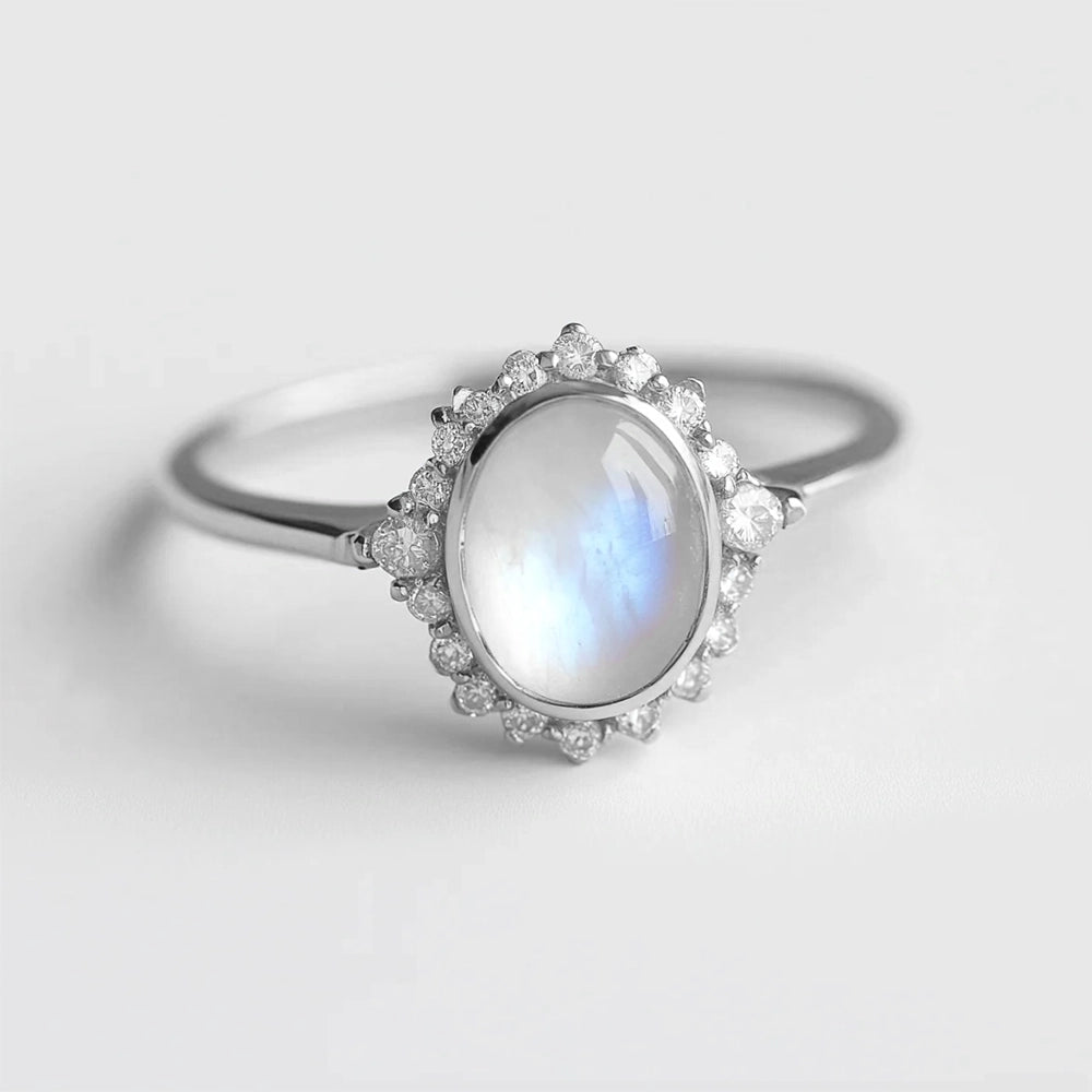 Elara’s Luster | Classic Oval Moonstone Halo Engagement Ring.