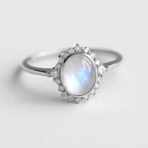 Elara’s Luster | Classic Oval Moonstone Halo Engagement Ring.