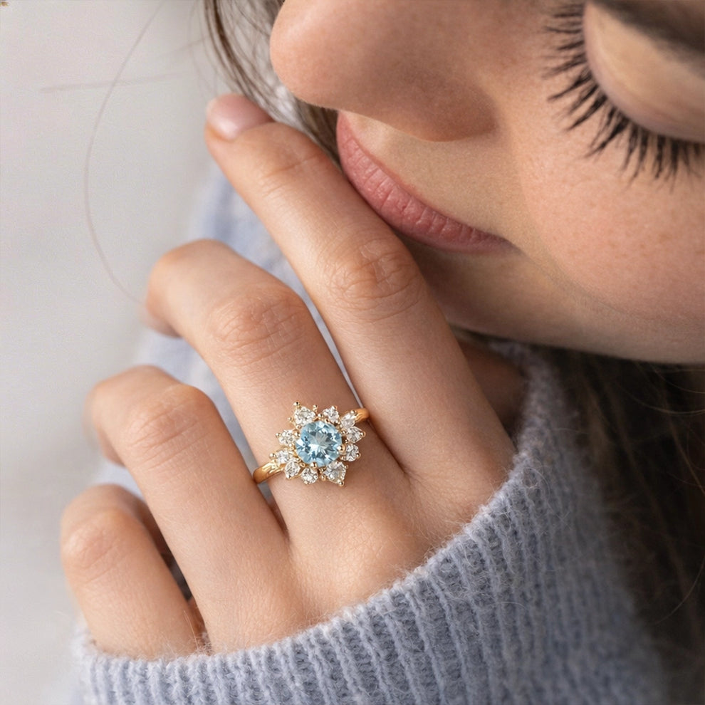 Marina's Blossom | Round Cut Aquamarine Engagement Ring With Pear Moissanite Petals.
