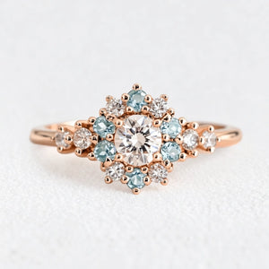 Liora's Corolla | Oval Diamond Engagement Ring with Aquamarine Petal Halo.