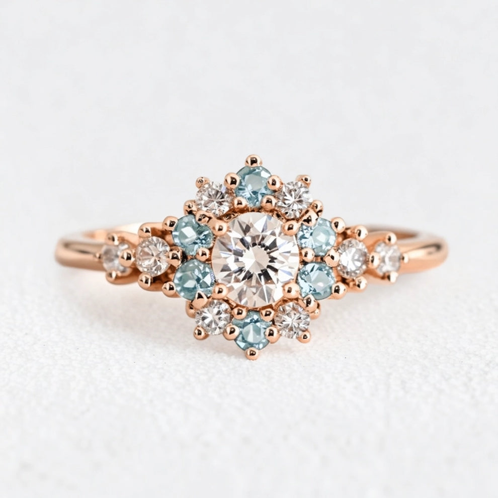 Liora's Corolla | Oval Diamond Engagement Ring with Aquamarine Petal Halo.