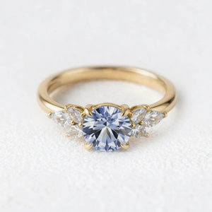 Selene’s Whisper | 1CT Round Cut Blue Sapphire Cluster Engagement Ring