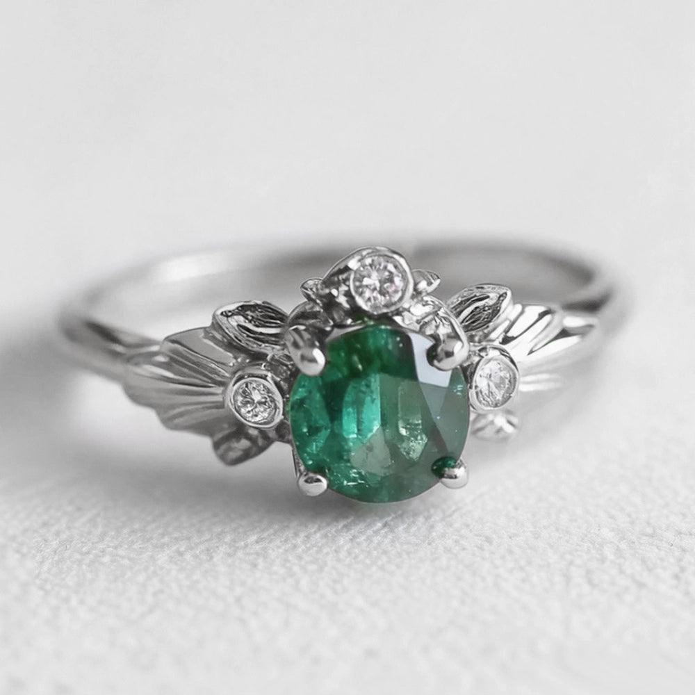 Eve’s Laurel | Natural Emerald Engagement Ring with Diamond Leaf Setting.