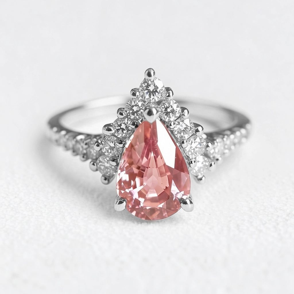 Aurora’s Promise |  Pear Cut Pink Sapphire Halo Engagement Ring.