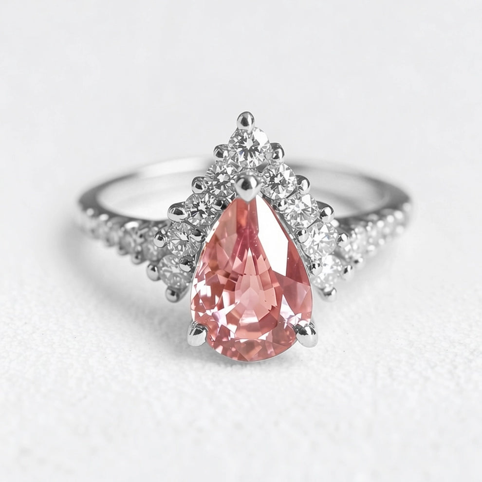Aurora’s Promise |  Pear Cut Pink Sapphire Halo Engagement Ring.
