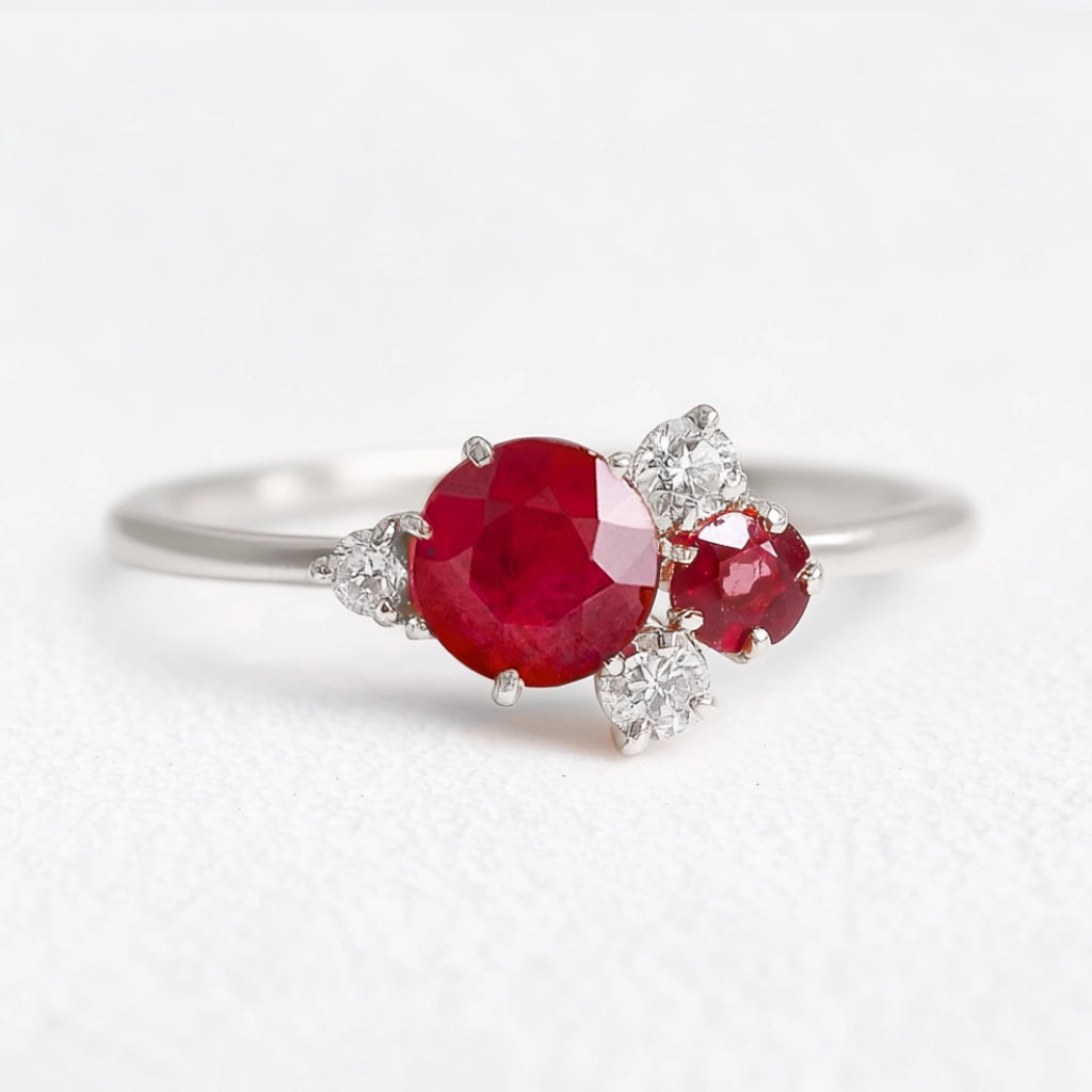Rosalind’s Rose | Round Ruby Engagement Ring with Drifting Diamond Petal Halo.