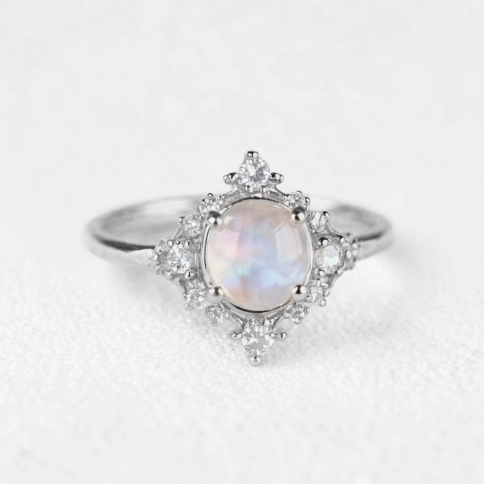The Eternal Stars Engagement Ring – Cabochon Moonstone & Graduated Diamond Halo.