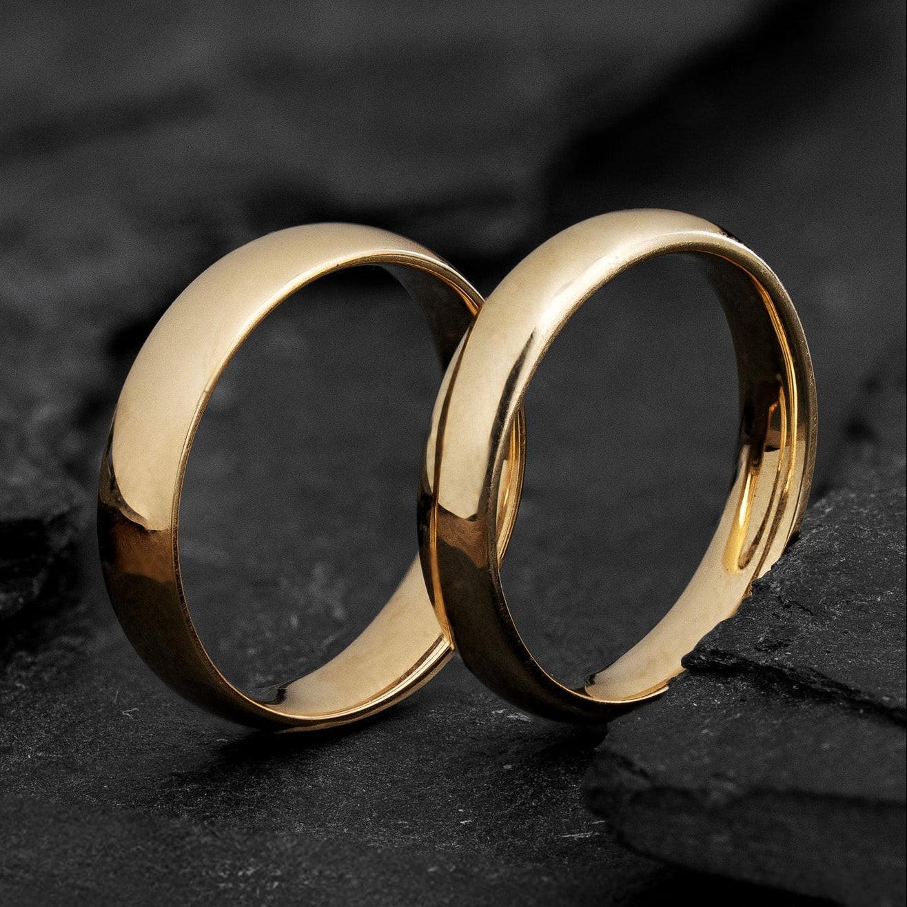 The Mirrored Pair – Polished Arc Wedding Bands in Solid Gold.