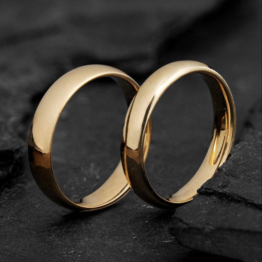 The Mirrored Pair – Polished Arc Wedding Bands in Solid Gold.