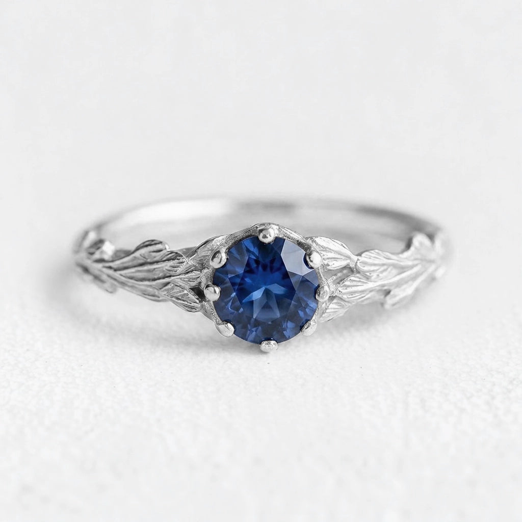 Athena’s Wisdom | Round Blue Sapphire Olive Branch Engagement Ring
