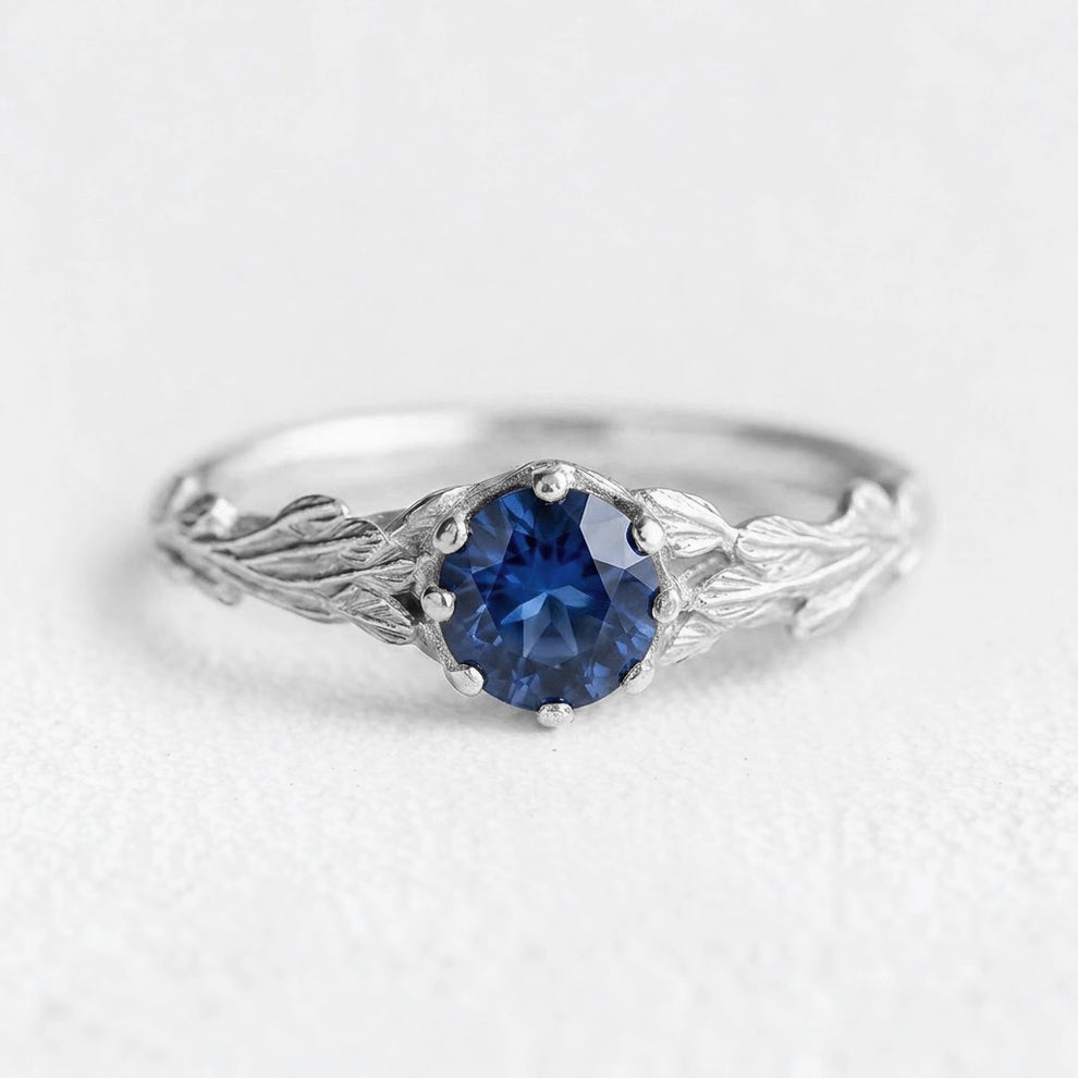 Athena’s Wisdom | Round Blue Sapphire Olive Branch Engagement Ring