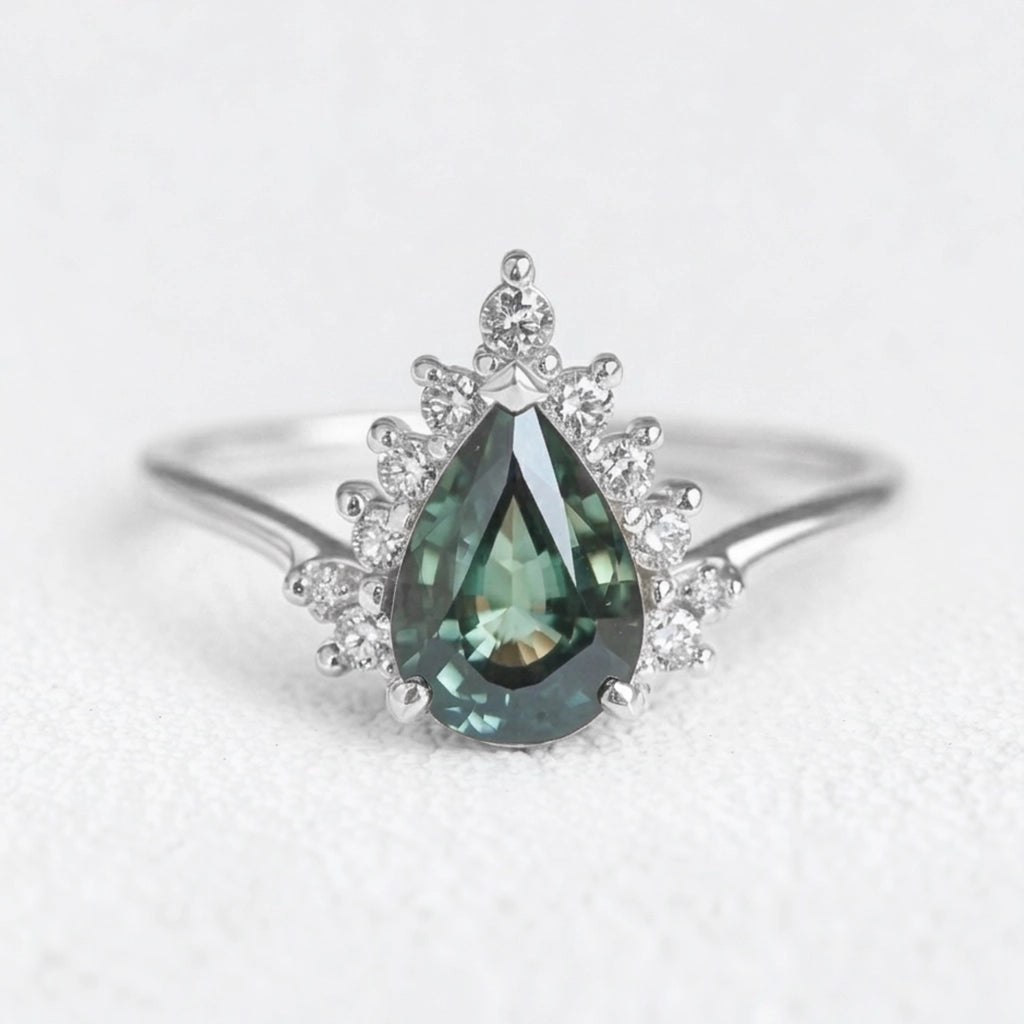Mermaid’s Crown | Pear Teal Sapphire Halo Engagement Ring.