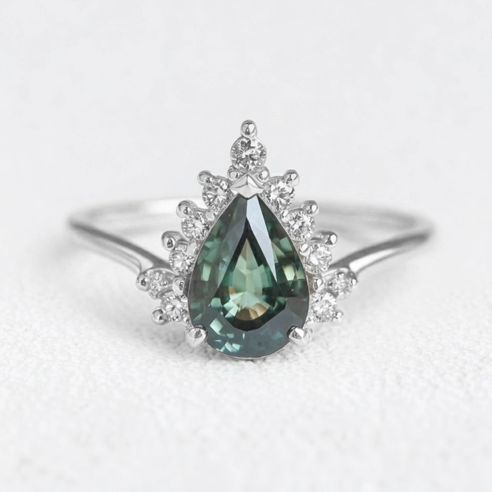 Mermaid’s Crown | Pear Teal Sapphire Halo Engagement Ring.