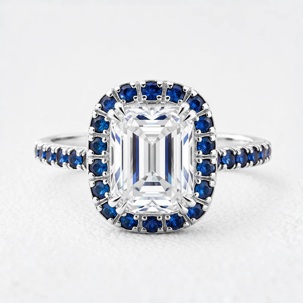 Aurora’s Luminary | 2CT Emerald Cut Diamond Sapphire Halo & Pavé Ring