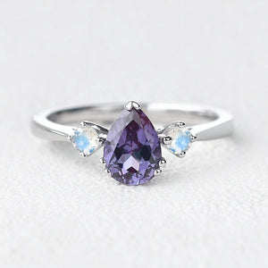 Selene’s Mirage | Pear Tanzanite & Moonstone Engagement Ring