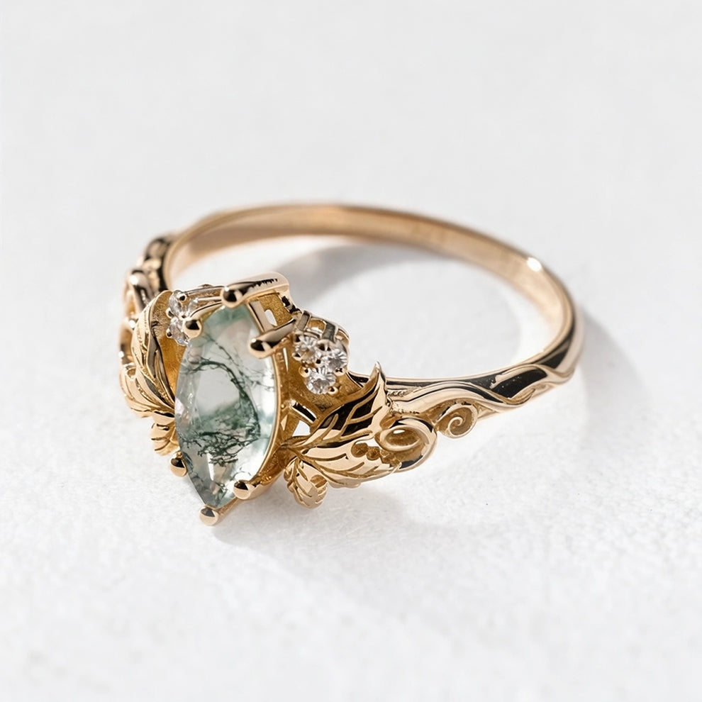 Flora’s Laurel | Marquise Cut Moss Agate Engagement Ring with Diamond Leaves.