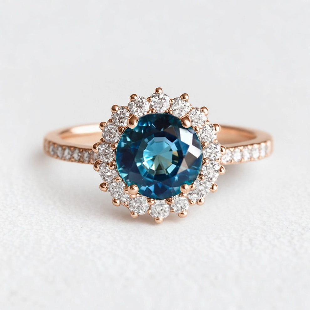Stella's Spark | Vintage Blue Sapphire Diamond Halo Engagement Ring.