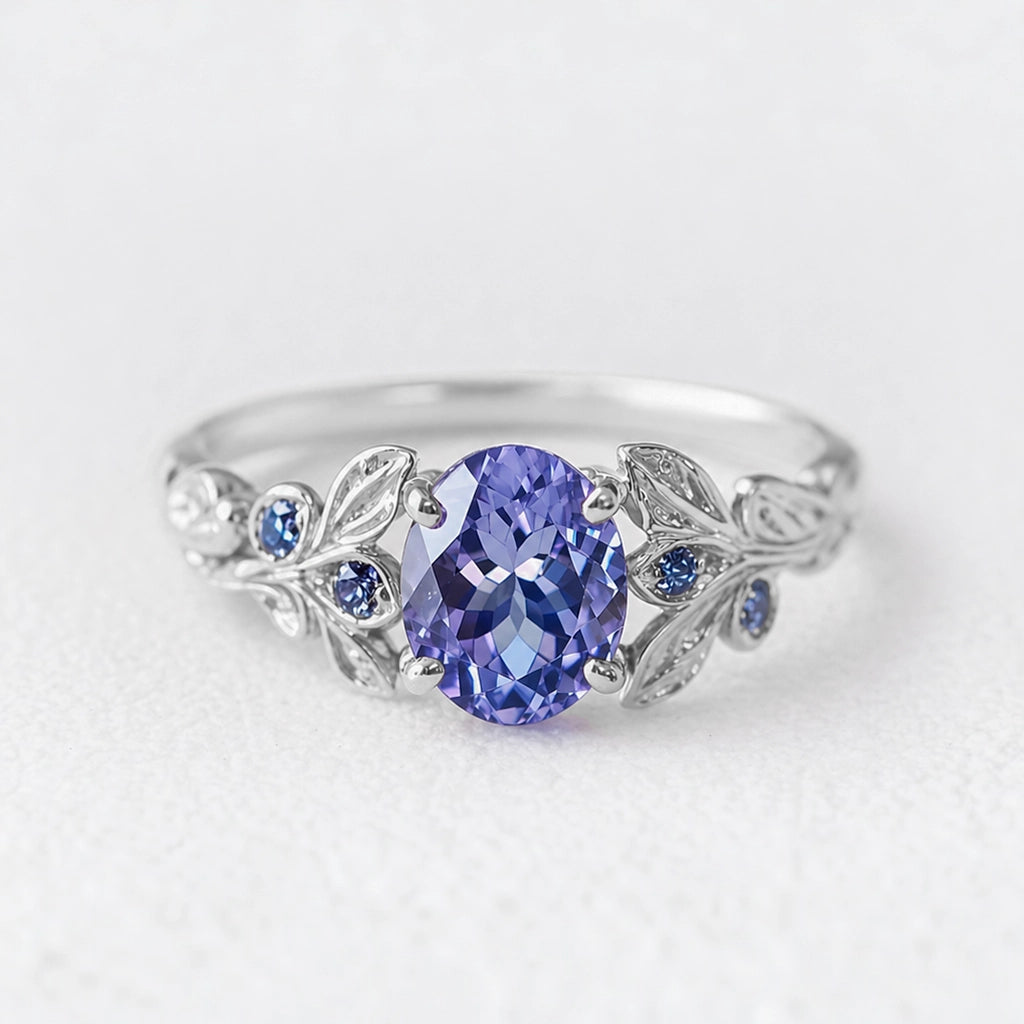 Aria‘s Glade | Oval Cut Tanzanite & Blue Diamond Leaf Engagement Ring.
