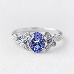 Aria‘s Glade | Oval Cut Tanzanite & Blue Diamond Leaf Engagement Ring.