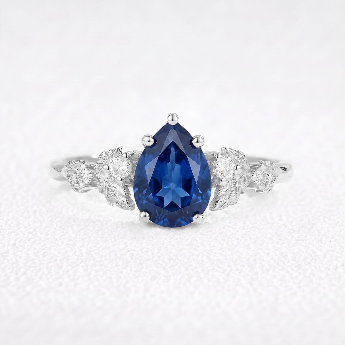 Daisy’s Twilight | 1.5CT Pear Cut Blue Sapphire Engagement Ring