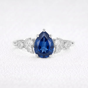 Daisy’s Twilight | 1.5CT Pear Cut Blue Sapphire Engagement Ring