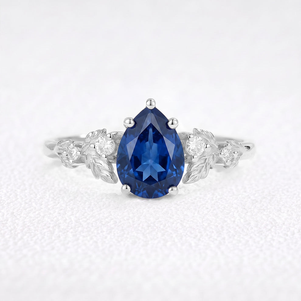 Daisy’s Twilight | 1.5CT Pear Cut Blue Sapphire Engagement Ring