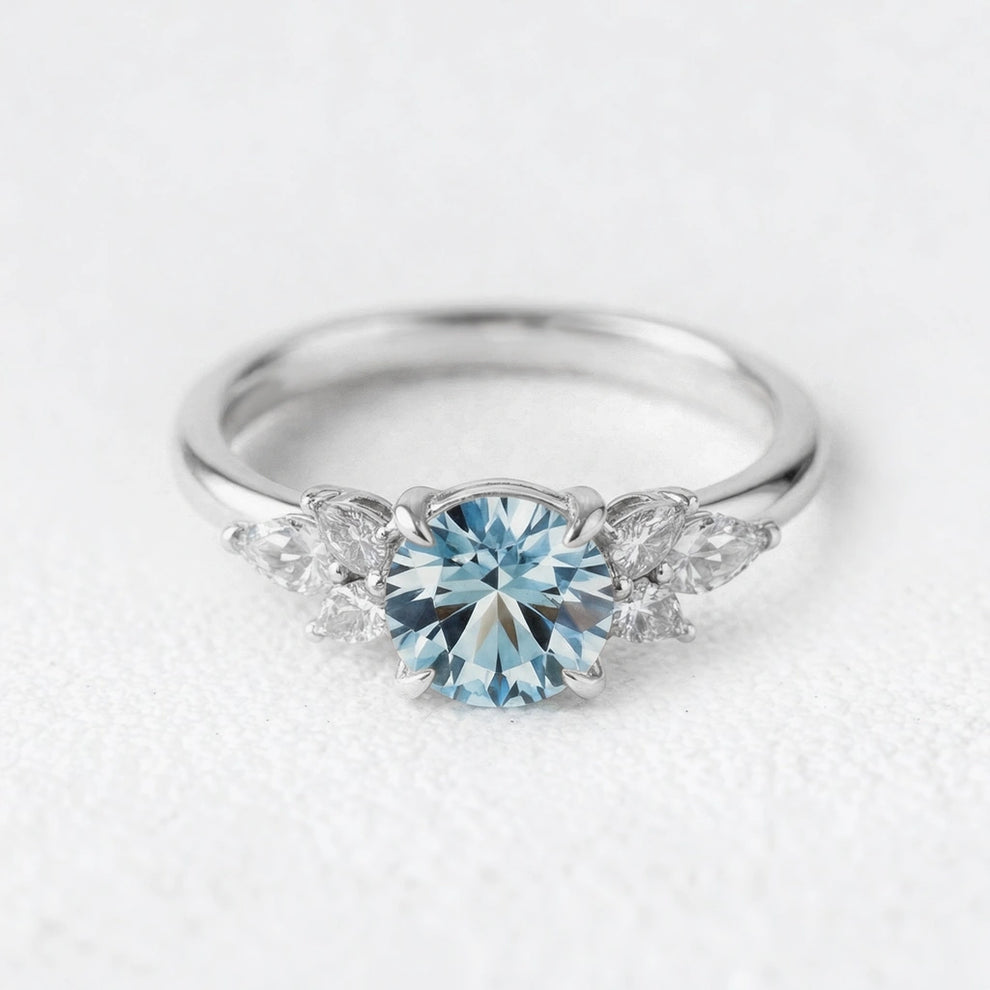 Selene’s Whisper | 1CT Round Cut Blue Sapphire Cluster Engagement Ring