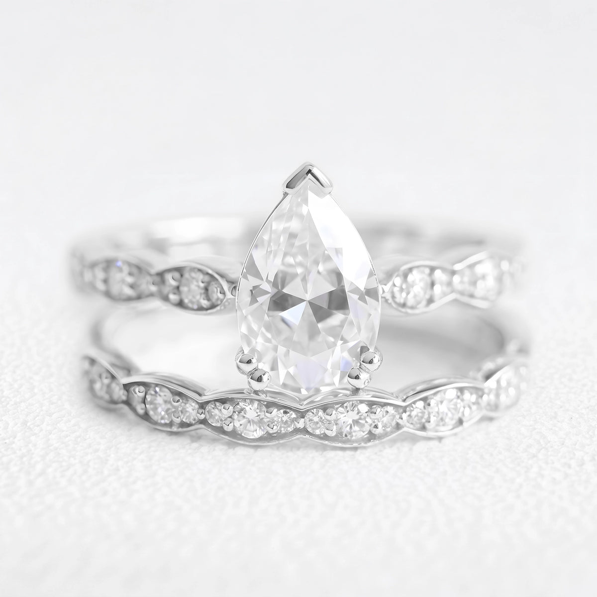 Genevieve’s Harmony | 1.5CT Pear Cut Diamond with Scalloped Pavé Bridal Duo