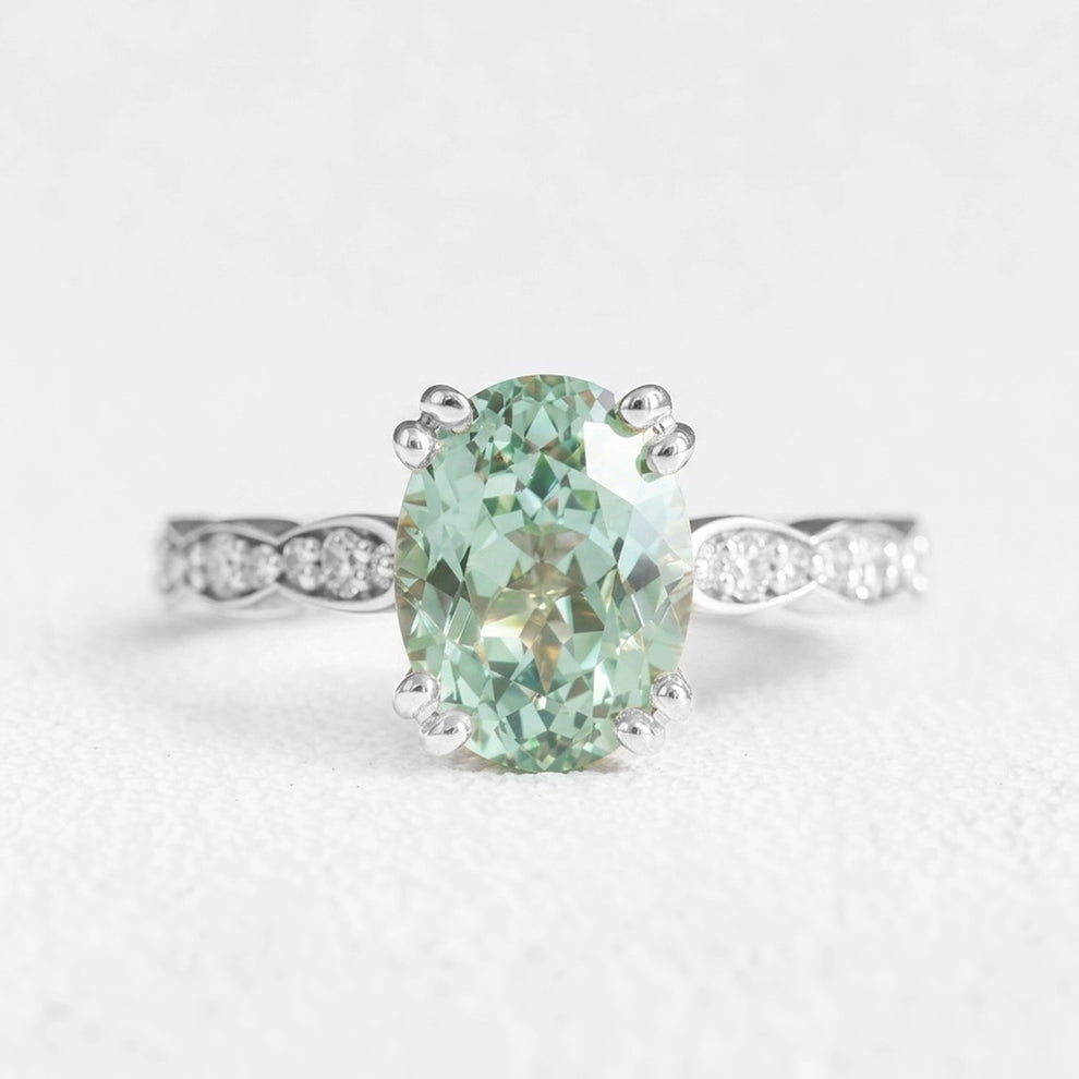 Lydia's Lace | 2CT Oval Green Sapphire Engagement Ring with Lace-Trim Diamond Band.