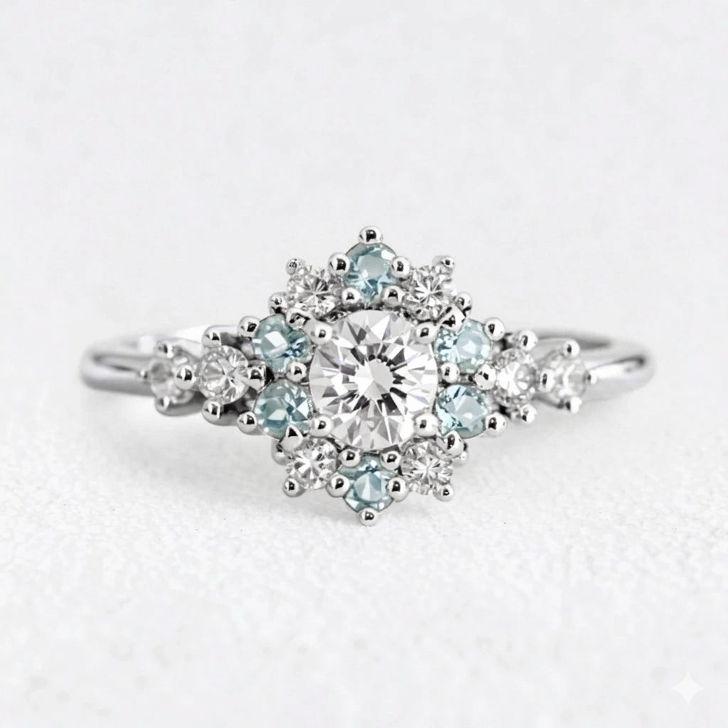Liora's Corolla | Oval Diamond Engagement Ring with Aquamarine Petal Halo.