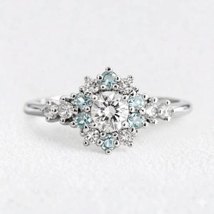 Liora's Corolla | Oval Diamond Engagement Ring with Aquamarine Petal Halo.