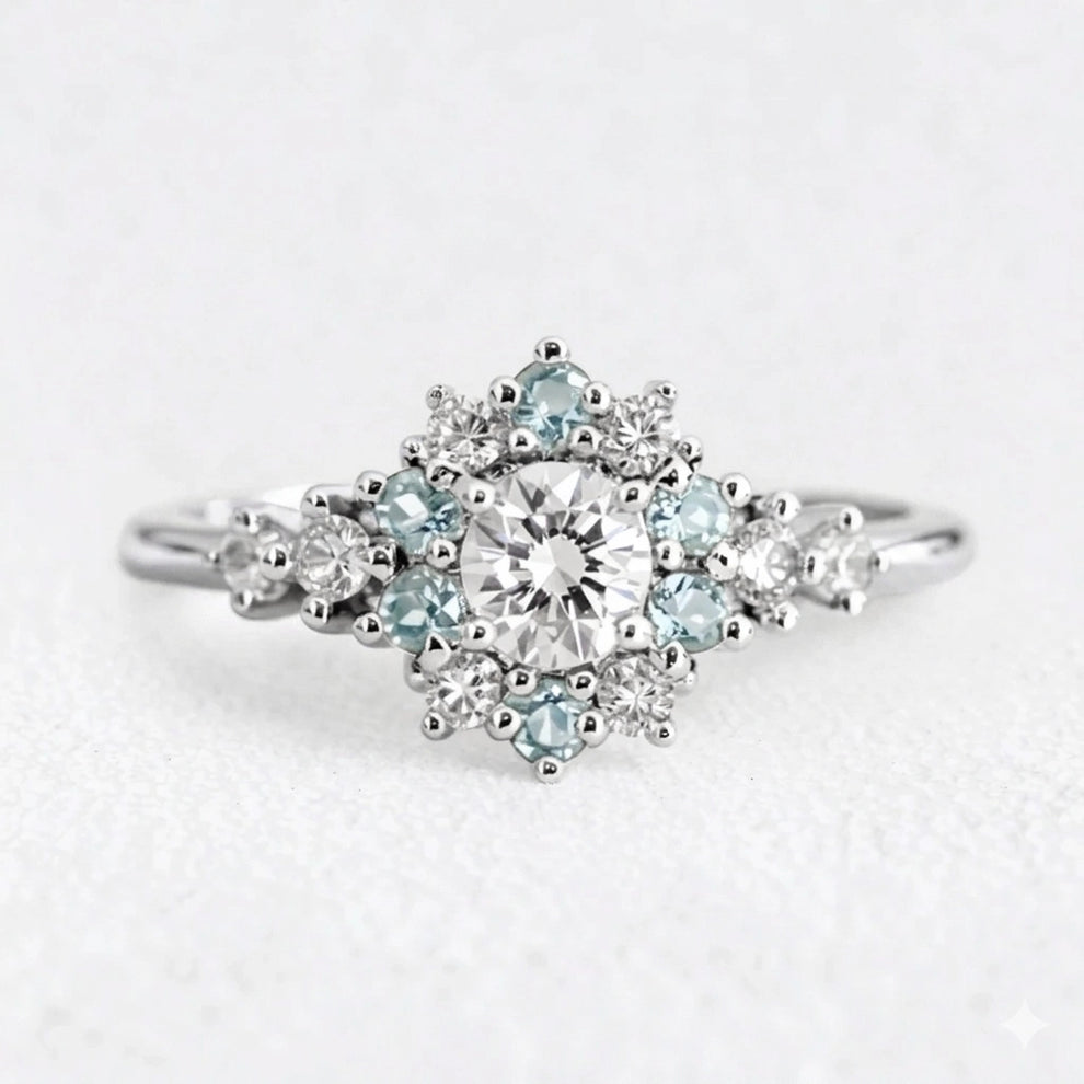 Liora's Corolla | Oval Diamond Engagement Ring with Aquamarine Petal Halo.