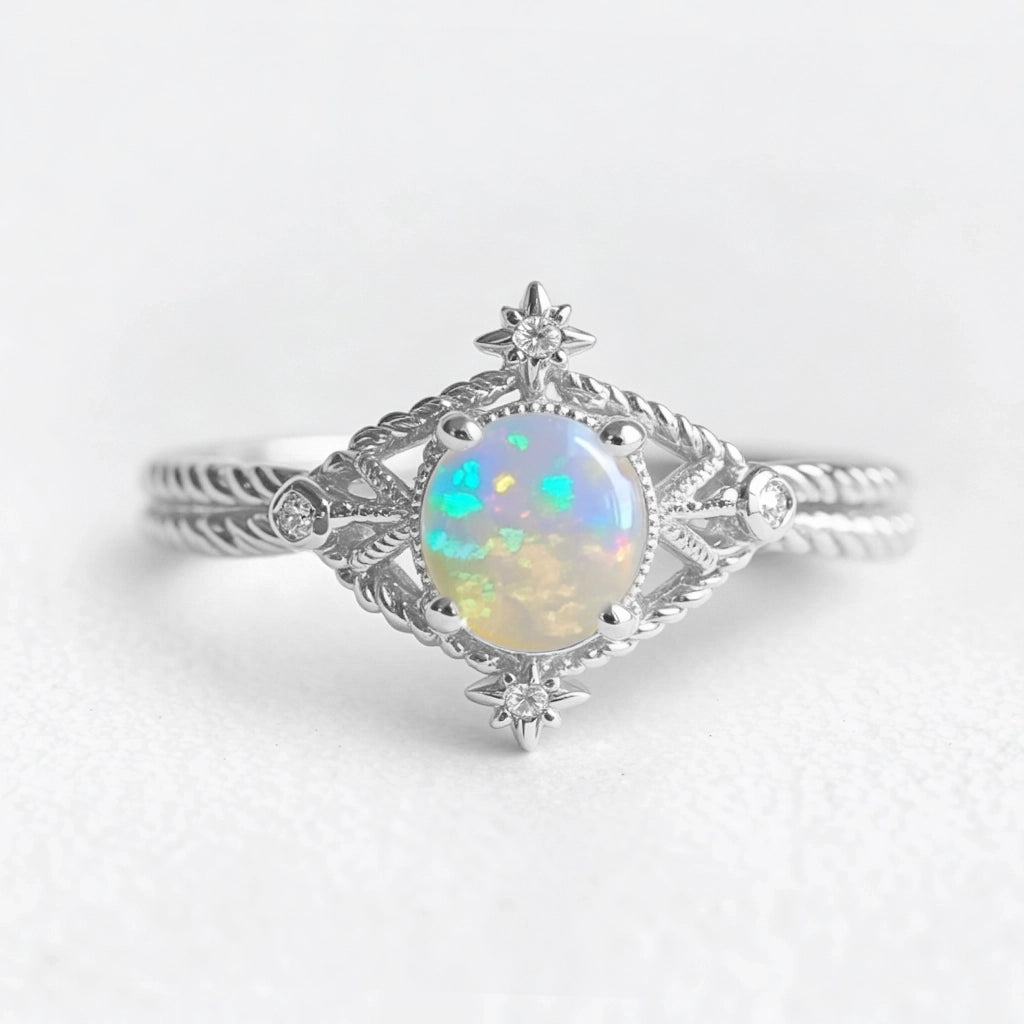 Aurora’s Knotwork | Round Opal Engagement Ring with Open Lozenge Weave & Nodes.