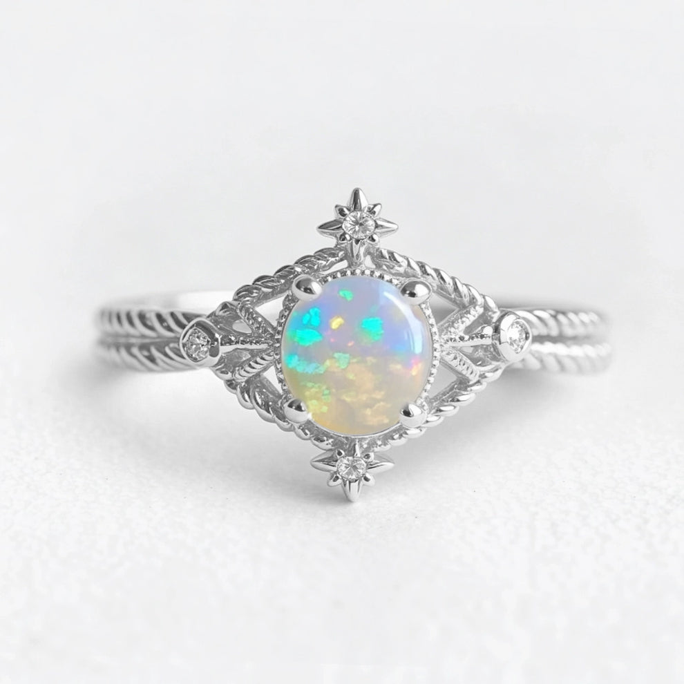 Aurora’s Knotwork | Round Opal Engagement Ring with Open Lozenge Weave & Nodes.