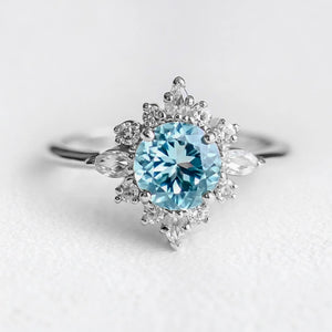 Marina's Swell | Round Cut Aquamarine Halo Engagement Ring.