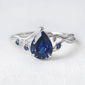 Athena’s Royalty | 1CT Pear Cut Royal Blue Sapphire Engagement Ring.