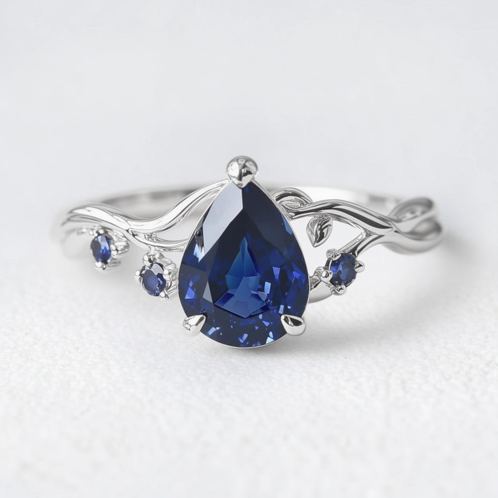 Athena’s Royalty | 1CT Pear Cut Royal Blue Sapphire Engagement Ring.