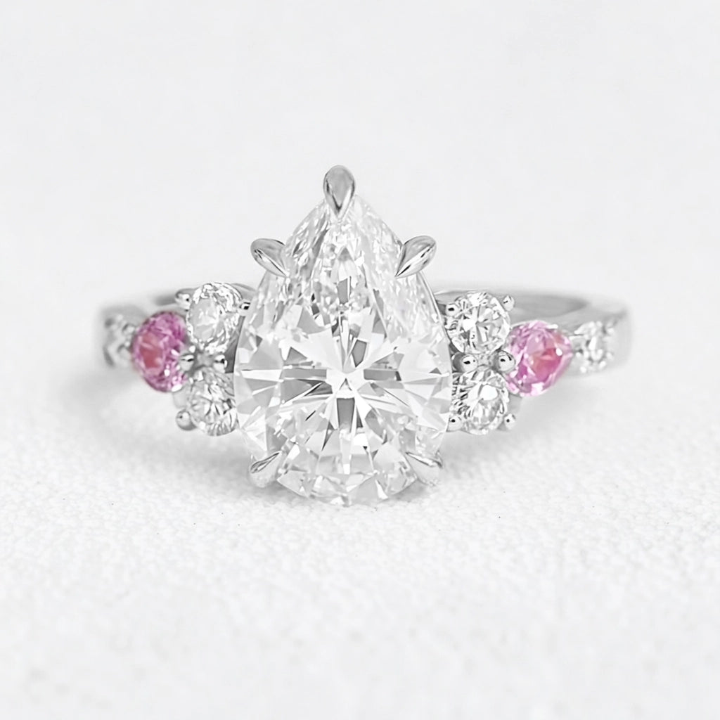 Aurora’s Embrace | Vintage 2CT Pear Cut Diamond Twin Trio Engagement Ring.