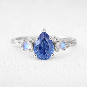 Asteria’s Moonveil | Pear Fantasy-Cut Royal Blue Sapphire & Moonstone Filigree Engagement Ring