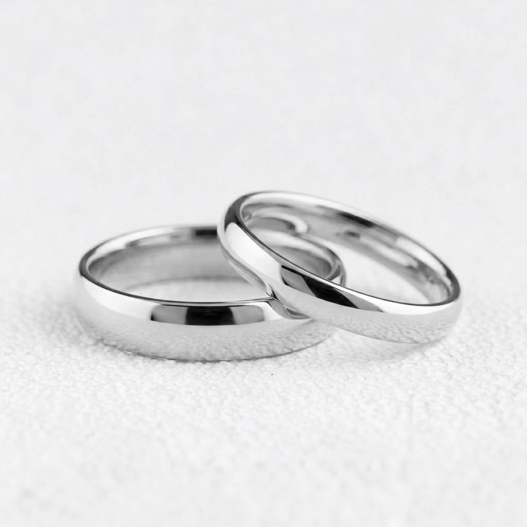The Mirrored Pair – Polished Arc Wedding Bands in Solid Gold.