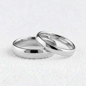 The Mirrored Pair – Polished Arc Wedding Bands in Solid Gold.