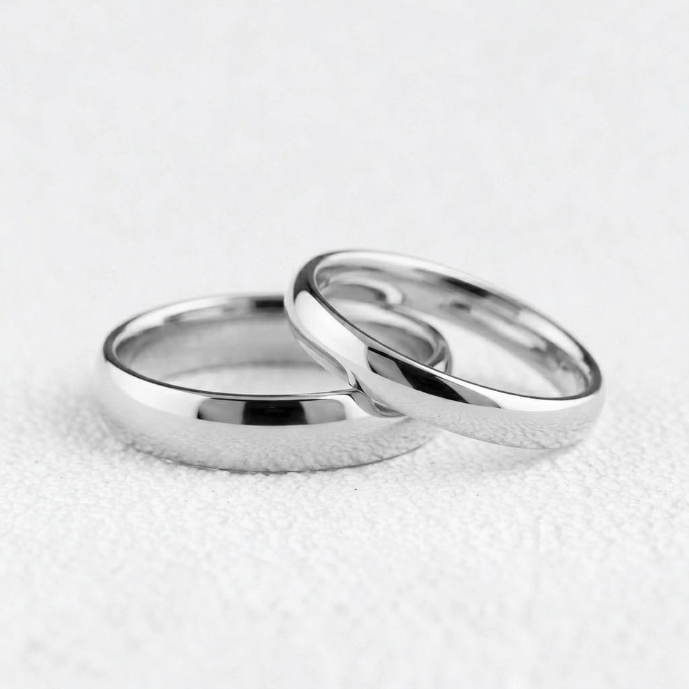 The Mirrored Pair – Polished Arc Wedding Bands in Solid Gold.